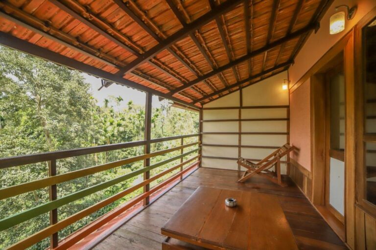 Patio wooden cottage Nelaji by Homestays Karnataka 768x512